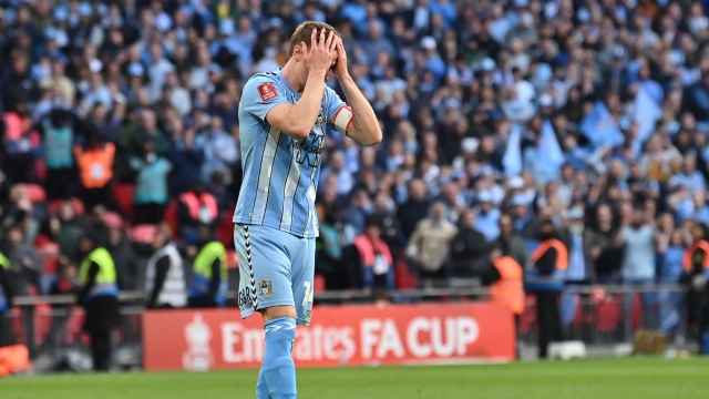Coventry City's English midfielder #14 Ben Sheaf reacts after hitting his penalty over the crossbar during the shoot-out during the English FA Cup semi-final football match between Coventry City and Manchester United at Wembley Stadium in north west London on April 21, 2024. (Photo by Glyn KIRK / AFP) / NOT FOR MARKETING OR ADVERTISING USE / RESTRICTED TO EDITORIAL USE