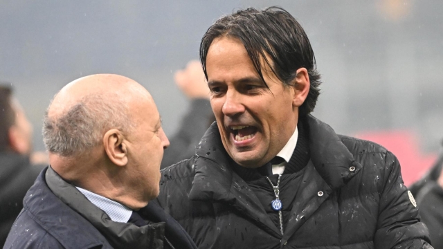 Inter's coach Simone Inzaghi (R) and CEO Giuseppe Marotta celebrate at the end of the Italian Serie A soccer match between Ac Milan and Inter Milan at the Giuseppe Meazza stadium in Milan, Italy, 22 April 2024. ANSA/DANIEL DAL ZENNARO