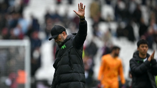 Liverpool's German manager Jurgen Klopp waves to fans on the pitch after the English Premier League football match between West Ham United and Liverpool at the London Stadium, in London on April 27, 2024. The game ended 2-2. (Photo by Ben Stansall / AFP) / RESTRICTED TO EDITORIAL USE. No use with unauthorized audio, video, data, fixture lists, club/league logos or 'live' services. Online in-match use limited to 120 images. An additional 40 images may be used in extra time. No video emulation. Social media in-match use limited to 120 images. An additional 40 images may be used in extra time. No use in betting publications, games or single club/league/player publications. /