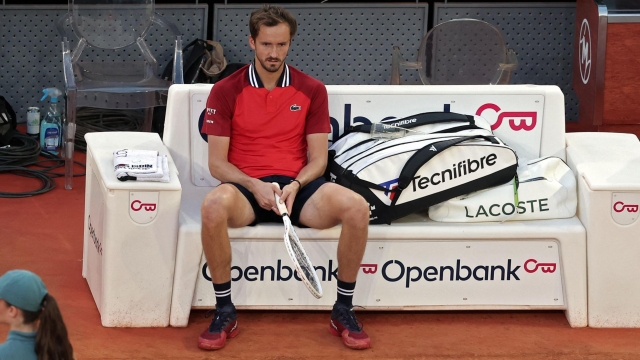 Russia's Daniil Medvedev sits on the bench prior to pulling out his match against Czech Republic's Jiri Lehecka during the 2024 ATP Tour Madrid Open tournament quarter-final tennis match at Caja Magica in Madrid on May 2, 2024. (Photo by Thomas COEX / AFP)