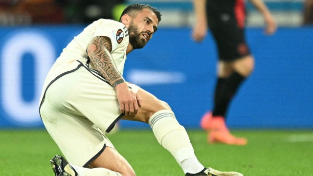 Roma's Italian defender #37 Leonardo Spinazzola is injured during the UEFA Europa League semi final second leg football match between Bayer Leverkusen and ASC Roma in Leverkusen, on May 9, 2024. (Photo by INA FASSBENDER / AFP)