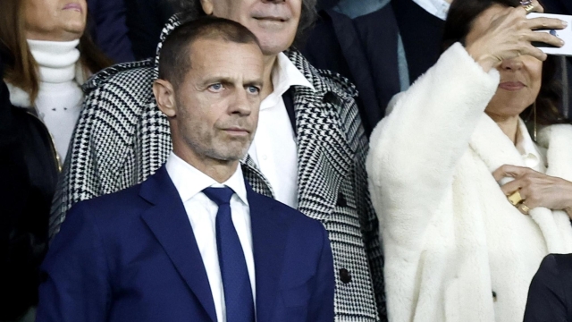 epa11271156 French Sports Minister Amelie Oudea-Castera (R) and UEFA president Aleksander Ceferin wait for the start of the UEFA Champions League quarter-finals, 1st leg soccer match between Paris Saint-Germain and FC Barcelona, in Paris, France, 10 April 2024.  EPA/MOHAMMED BADRA