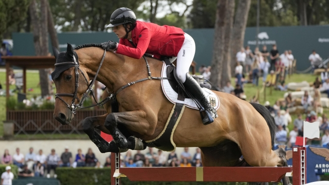 Germany's Kendra Claricia Brinkop on Tabasco de Toxandria Z competes during the Nation Cup at the Grand Prix competition at Rome's Piazza di Siena International Horse Show, Friday, May 24, 2024. (AP Photo/Gregorio Borgia)