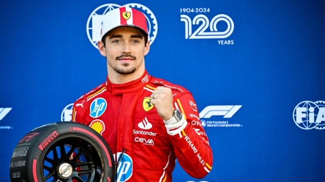 Ferrari's Monegasque driver Charles Leclerc poses after winning the qualifying session of the Formula One Monaco Grand Prix on May 25 2024 at the Circuit de Monaco, on the eve of the race. (Photo by ANDREJ ISAKOVIC / AFP)