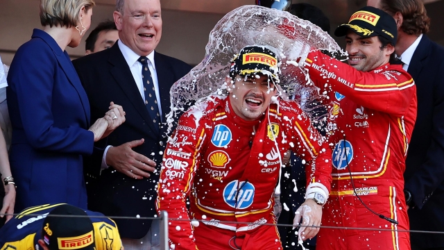 MONTE-CARLO, MONACO - MAY 26: Race winner Charles Leclerc of Monaco and Ferrari and Third placed Carlos Sainz of Spain and Ferrari celebrate on the podium during the F1 Grand Prix of Monaco at Circuit de Monaco on May 26, 2024 in Monte-Carlo, Monaco. (Photo by Ryan Pierse/Getty Images) *** BESTPIX ***