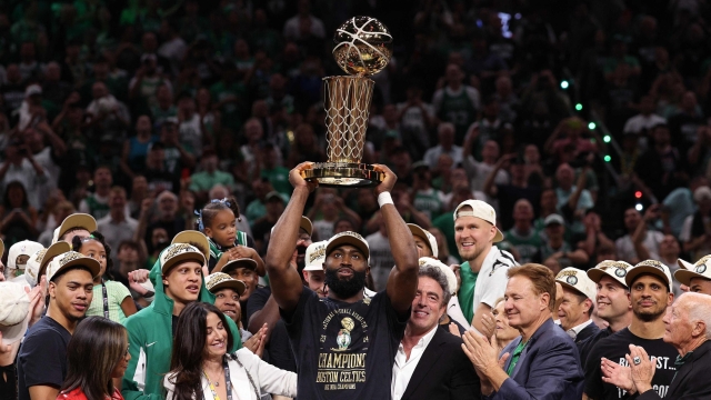 BOSTON, MASSACHUSETTS - JUNE 17: Jaylen Brown #7 of the Boston Celtics holds up the Larry O'Brien trophy after Boston's 106-88 win against the Dallas Mavericks in Game Five of the 2024 NBA Finals at TD Garden on June 17, 2024 in Boston, Massachusetts. NOTE TO USER: User expressly acknowledges and agrees that, by downloading and or using this photograph, User is consenting to the terms and conditions of the Getty Images License Agreement.   Elsa/Getty Images/AFP (Photo by ELSA / GETTY IMAGES NORTH AMERICA / Getty Images via AFP)