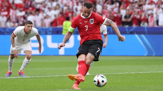BERLIN, GERMANY - JUNE 21: Marko Arnautovic of Austria scores his team's third goal from a penalty kick as Wojciech Szczesny of Poland (not pictured) fails to make a save during the UEFA EURO 2024 group stage match between Poland and Austria at Olympiastadion on June 21, 2024 in Berlin, Germany. (Photo by Alex Livesey/Getty Images)
