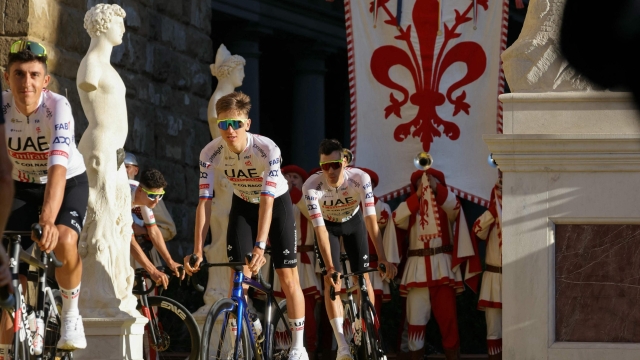 UAE Team Emirates team's Slovenian rider Tadej Pogacar (C) cycles with teammates during the team presentation for the 111th edition of the Tour de France cycling race, in Florence in Italy, on June 27, 2024. (Photo by Thomas SAMSON / AFP)