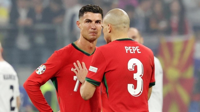 epa11451303 Cristiano Ronaldo (L) and Pepe (R) of Portugal during the UEFA EURO 2024 Round of 16 soccer match between Portugal and Slovenia, in Frankfurt Main, Germany, 01 July 2024.  EPA/MOHAMED MESSARA