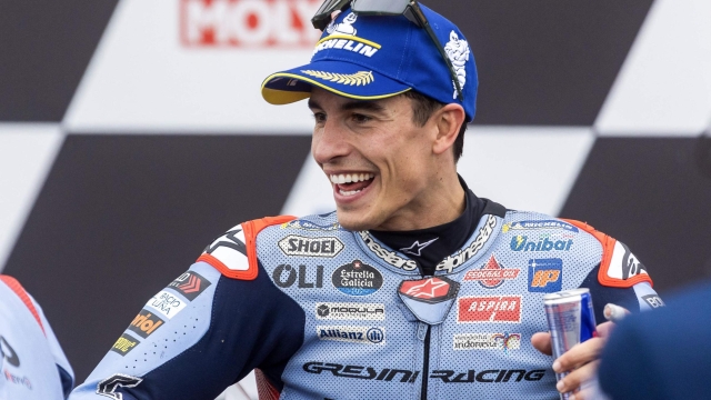 Second placed Gresini Racing MotoGP's Spanish rider Marc Marquez celebrates on the podium after the German Motorcycle Grand Prix at the Sachsenring racetrack in Hohenstein-Ernstthal, eastern Germany, on July 7, 2024.  (Photo by Radek Mica / AFP)
