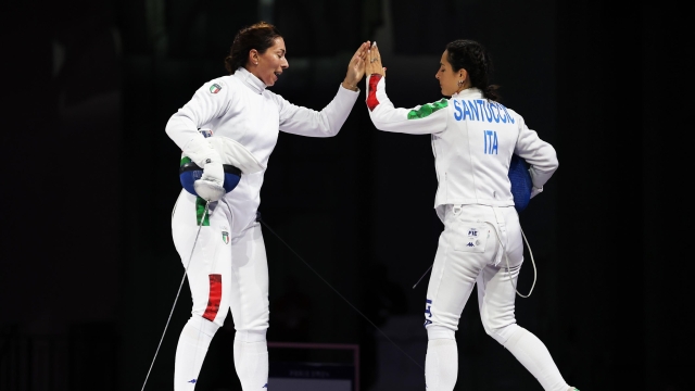 PARIS, FRANCE - JULY 30: Mara Navarria (L) interacts with teammate Alberta Santuccio of Team Italy during the Fencing Women's Epee Team Gold Medal match between Team France and Team Ital on day four of the Olympic Games Paris 2024 at Grand Palais on July 30, 2024 in Paris, France. (Photo by Elsa/Getty Images)