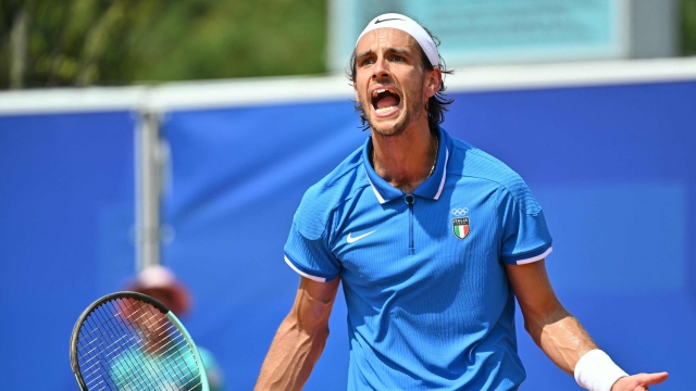 Italy's Lorenzo Musetti reacts to beating Argentina's Mariano Navone in their men's singles second round tennis match at the Roland-Garros Stadium at the Paris 2024 Olympic Games, in Paris on July 30, 2024. (Photo by Miguel MEDINA / AFP)