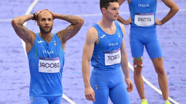 (L - R) Italy's Lamont Marcell Jacobs, Filippo Tortu and Lorenzo Patta react after the Men's 4x100m Relay final of the Athletics competitions in the Paris 2024 Olympic Games, at the Stade de France stadium in Saint Denis, France, 9 August 2024. ANSA/ETTORE FERRARI