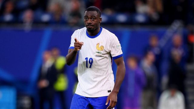 HAMBURG, GERMANY - JULY 05: Youssouf Fofana of France celebrates scoring the team's fourth penalty in the penalty shoot out during the UEFA EURO 2024 quarter-final match between Portugal and France at Volksparkstadion on July 05, 2024 in Hamburg, Germany. (Photo by Justin Setterfield/Getty Images)