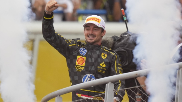 Ferrari driver Charles Leclerc of Monaco celebrates on the podium after the Formula One Italian Grand Prix race at the Monza racetrack, in Monza, Italy, Sunday, Sept. 1, 2024. (AP Photo/Luca Bruno)