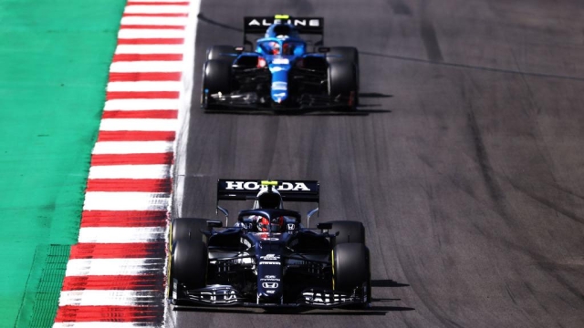 PORTIMAO, PORTUGAL - MAY 02: Pierre Gasly of France driving the (10) Scuderia AlphaTauri AT02 Honda leads Esteban Ocon of France driving the (31) Alpine A521 Renault during the F1 Grand Prix of Portugal at Autodromo Internacional Do Algarve on May 02, 2021 in Portimao, Portugal. (Photo by Lars Baron/Getty Images)