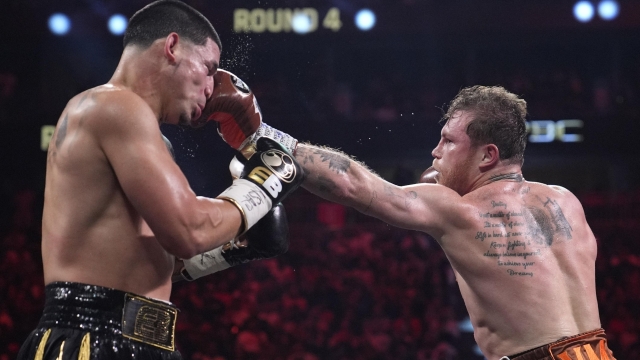 Canelo Alvarez hits Edgar Berlanga in a super middleweight title bout Saturday, Sept. 14, 2024, in Las Vegas. (AP Photo/John Locher)