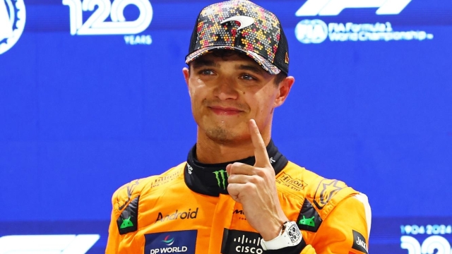 SINGAPORE, SINGAPORE - SEPTEMBER 21: Pole position qualifier Lando Norris of Great Britain and McLaren celebrates in parc ferme during qualifying ahead of the F1 Grand Prix of Singapore at Marina Bay Street Circuit on September 21, 2024 in Singapore, Singapore. (Photo by Mark Thompson/Getty Images)