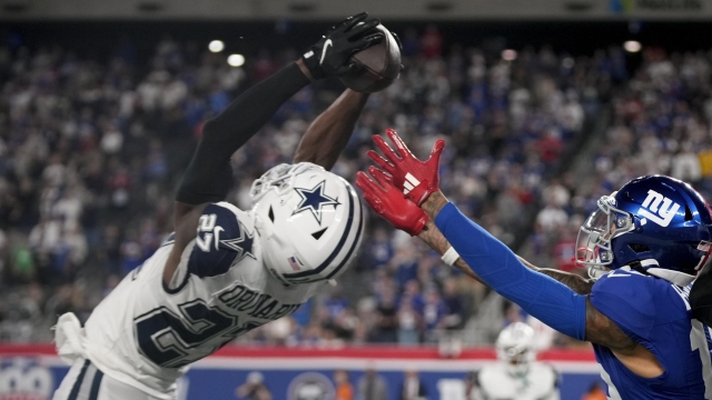 Dallas Cowboys cornerback Amani Oruwariye (27) intercepts a pass intended for New York Giants wide receiver Isaiah Hodgins (18) during the fourth quarter of an NFL football game, Thursday, Sept. 26, 2024, in East Rutherford, N.J. (AP Photo/Bryan Woolston)