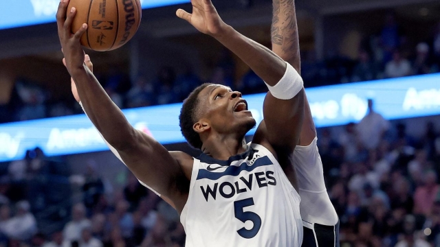 DALLAS, TEXAS - MAY 26: Anthony Edwards #5 of the Minnesota Timberwolves goes to the basket against Daniel Gafford #21 of the Dallas Maverick in the third quarter during Game Three of the Western Conference Finals at American Airlines Center on May 26, 2024 in Dallas, Texas. NOTE TO USER: User expressly acknowledges and agrees that, by downloading and or using this photograph, User is consenting to the terms and conditions of the Getty Images License Agreement.   Matthew Stockman/Getty Images/AFP (Photo by MATTHEW STOCKMAN / GETTY IMAGES NORTH AMERICA / Getty Images via AFP)