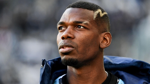 (FILES) Juventus' French midfielder Paul Pogba looks on prior to the Italian Serie A football match between Juventus and Monza at the Juventus Stadium in Turin on January 29, 2023. The French midfielder's drug ban has been cut to 18 months from 4 years the Court of Arbitration for Sport announced on October 4, 2024. (Photo by Isabella BONOTTO / AFP)