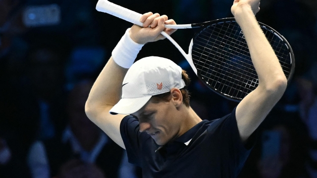 Italy's Jannik Sinner celebrates after winning the final against USA's Taylor Fritz at the ATP Finals tennis tournament in Turin on November 17, 2024. (Photo by Marco BERTORELLO / AFP)