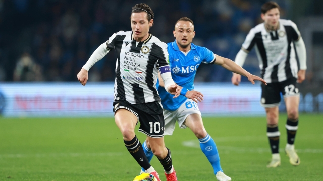 NAPLES, ITALY - FEBRUARY 09: Florian Thauvin of Udinese battles for possession with Stanislav Lobotka of Napoli during the Serie A match between Napoli and Udinese at Stadio Diego Armando Maradona on February 09, 2025 in Naples, Italy. (Photo by Francesco Pecoraro/Getty Images)
