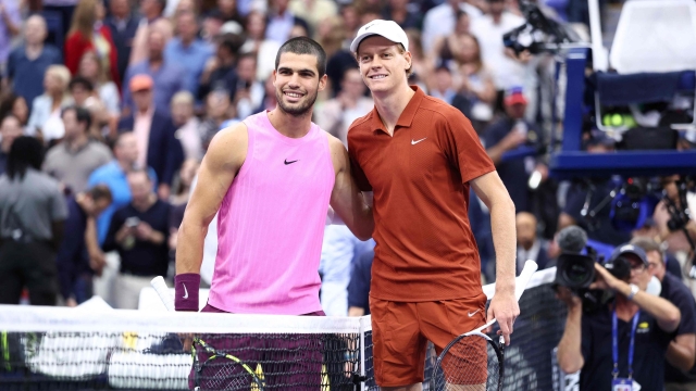 Italy’s Jannik Sinner (R) and Spain’s Carlos Alcaraz pose ahead of their men's singles final tennis match on day fifteen of the US Open tennis tournament at the USTA Billie Jean King National Tennis Center in New York City, on September 7, 2025. (Photo by CHARLY TRIBALLEAU / AFP)