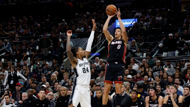 Simone Fontecchio #0 of the Miami Heat shoots a three-point shot over Devin Vassell #24 of the San Antonio Spurs in first half at Frost Bank Center on October 30, 2025 in San Antonio, Texas. NOTE TO USER: User expressly acknowledges and agrees that, by downloading and or using this photograph, User is consenting to terms and conditions of the Getty Images License Agreement.   Ronald Cortes/Getty Images/AFP (Photo by Ronald Cortes / GETTY IMAGES NORTH AMERICA / Getty Images via AFP)