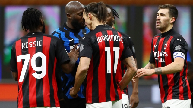 Romelu Lukaku of FC Internazionale clashes with Zlatan Ibrahimovic of AC Milan during the Coppa Italia match between FC Internazionale and AC Milan at Stadio Giuseppe Meazza on January 26, 2021 in Milan, Italy. Sporting stadiums around Italy remain under strict restrictions due to the Coronavirus Pandemic as Government social distancing laws prohibit fans inside venues resulting in games being played behind closed doors. (Photo by Marco Luzzani/Getty Images)