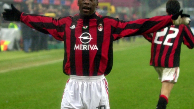 AC Milan Clarence Seedorf of Netherland celebrates after scoring during the Italian first division soccer match between AC Milan and Inter Milan at the San Siro stadium in Milan, Italy, Saturday, Feb. 21, 2004. (AP Photo/Antonio Calanni)