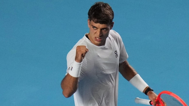Flavio Cobolli of Italy reacts after winning the first set tie break against Frances Tiafoe of the U.S. during the singles final match at the Mexican Open tennis championship in Acapulco, Mexico, Saturday, Feb. 28, 2026. (AP Photo/Eduardo Verdugo)