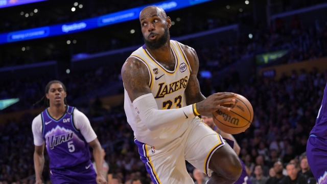 Los Angeles Lakers forward LeBron James looks to make a pass during the first half of an NBA basketball game against the Utah Jazz, Sunday, April 12, 2026, in Los Angeles. (AP Photo/Jayne Kamin-Oncea)