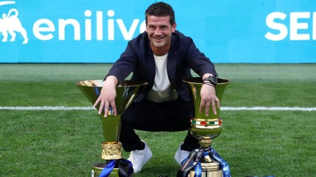  Cristian Chivu, Head Coach of FC Internazionale Milano, poses for a photo with the Coppa Campioni d'Italia and Coppa Italia trophies following the Serie A match between FC Internazionale and Hellas Verona FC at Giuseppe Meazza Stadium on May 17, 2026 in Milan, Italy. (Photo by Marco Luzzani/Getty Images)