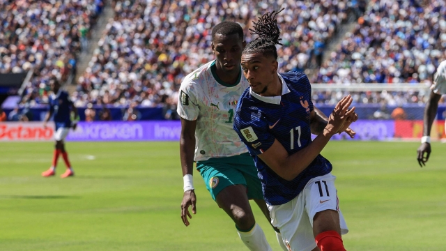 Senegal's forward #11 Nicolas Jackson and France's forward #11 Michael Olise fight for the ball during the 2026 World Cup Group I football match between France and Senegal at the New York/New Jersey Stadium in East Rutherford on June 16, 2026.  (Photo by TIMOTHY A. CLARY / AFP)