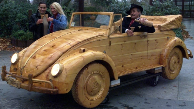 FILE - In this Nov. 17, 1999 file photo, a VW Maggiolino Cabriolet, the famous VW Beetle completely made of wood, is shown by Italian artist Livio De Marchi in Essen, Germany. Volkswagen is halting production of the last version of its Beetle model in July 2019 at its plant in Puebla, Mexico, the end of the road for a vehicle that has symbolized many things over a history spanning eight decades since 1938.(AP Photo/Karl-Heinz Kreifelts, file)