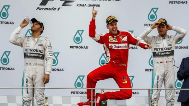 La prima vittoria di Vettel con la Ferrari nel 2015, in Malesia. Epa
