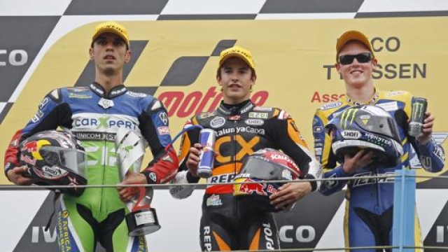 Sofuoglu con Marquez e Smith ad Assen nel 2011 in Moto2. Lapresse