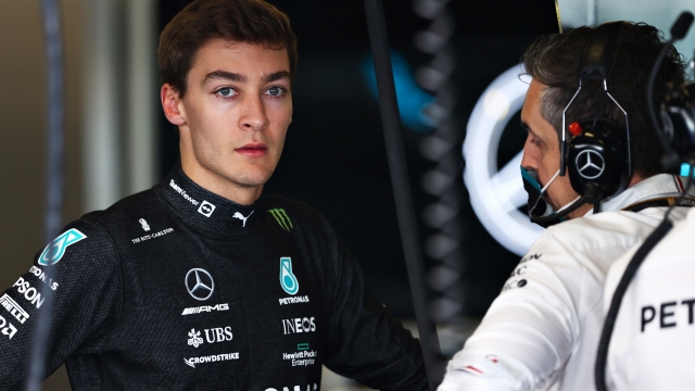 ABU DHABI, UNITED ARAB EMIRATES - DECEMBER 15: George Russell of Great Britain and Mercedes GP prepares to drive in the garage during Formula 1 testing at Yas Marina Circuit on December 15, 2021 in Abu Dhabi, United Arab Emirates. (Photo by Clive Rose/Getty Images)
