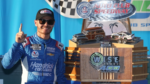 FONTANA, CALIFORNIA - FEBRUARY 27: Kyle Larson, driver of the #5 HendrickCars.com Chevrolet, celebrates in the Ruoff Mortgage victory lane after winning the NASCAR Cup Series Wise Power 400 at Auto Club Speedway on February 27, 2022 in Fontana, California.   James Gilbert/Getty Images/AFP == FOR NEWSPAPERS, INTERNET, TELCOS & TELEVISION USE ONLY ==