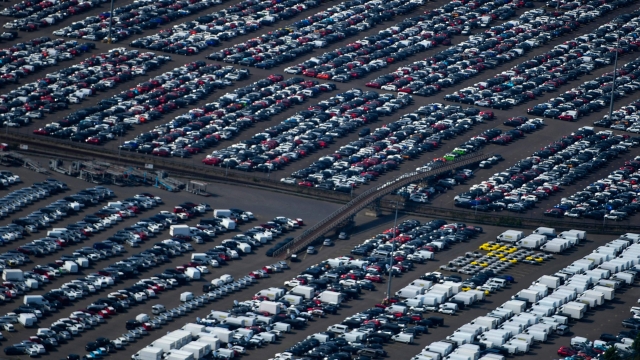 (FILES) In this file photo taken on May 08, 2020 shows an aerial view of new cars for sale at the harbour of Duisburg, western Germany. - The German car market experienced a 25% drop in July 2021, the first after four months of growth, and "the pre-crisis level is still not on the horizon" according to the VDA sector federation. (Photo by Ina FASSBENDER / AFP)