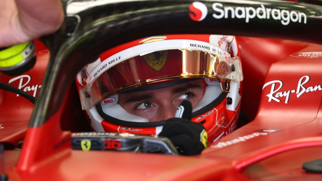 Ferrari's Monegasque driver Charles Leclerc sits in his car during the second day of Formula One (F1) pre-season testing at the Bahrain International Circuit in the city of Sakhir on March 11, 2022. (Photo by Giuseppe CACACE / AFP)