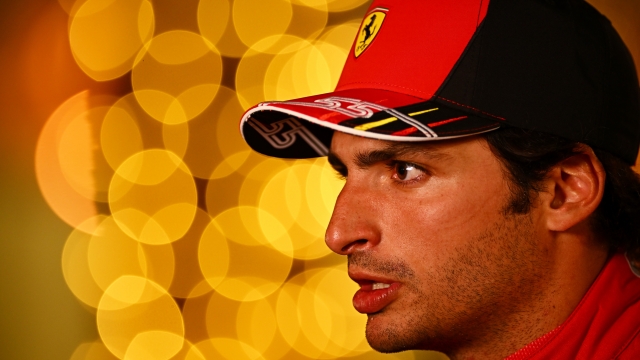 BAHRAIN, BAHRAIN - MARCH 19: Third place qualifier Carlos Sainz of Spain and Ferrari talks to the media in the Paddock after qualifying ahead of the F1 Grand Prix of Bahrain at Bahrain International Circuit on March 19, 2022 in Bahrain, Bahrain. (Photo by Clive Mason/Getty Images)