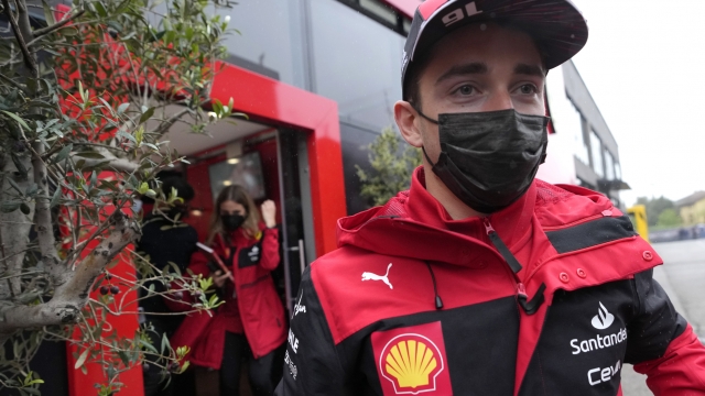 Ferrari driver Charles Leclerc of Monaco arrives in the paddock at the Dino and Enzo Ferrari racetrack, in Imola, Italy, Thursday, April 21, 2022. Italy's Emila Romagna Formula One Grand Prix will take place on Sunday. (AP Photo/Luca Bruno)