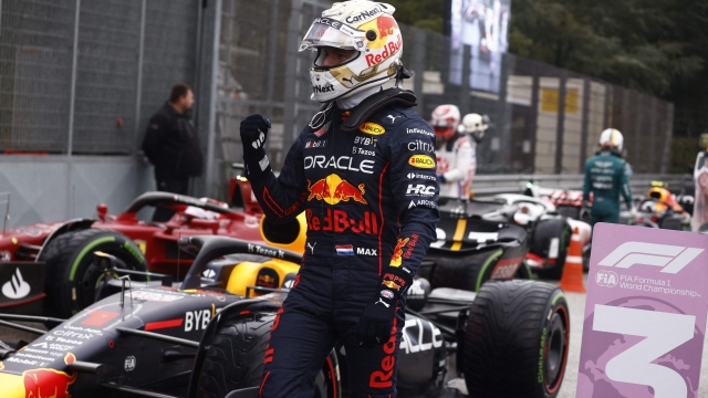 Red Bull Racing's Dutch driver Max Verstappen celebrates poll position for the Sprint race during the qualifying session at the Autodromo Internazionale Enzo e Dino Ferrari race track in Imola, Italy, on April 22, 2022,  ahead of the Formula One Emilia Romagna Grand Prix. (Photo by GUGLIELMO MANGIAPANE / POOL / AFP)