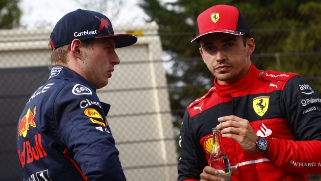 Ferrari's Monegasque driver Charles Leclerc (R) talks to Red Bull Racing's Dutch driver Max Verstappen after the sprint race at the Autodromo Internazionale Enzo e Dino Ferrari race track in Imola, Italy, on April 23, 2022,  ahead of the Formula One Emilia Romagna Grand Prix. (Photo by GUGLIELMO MANGIAPANE / POOL / AFP)