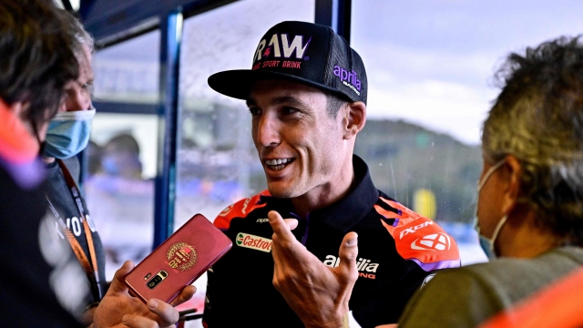 Aprilia Spanish rider Aleix Espargaro talks to the press as he leaves after attending a press conference ahead of the MotoGP Spanish Grand Prix at the Jerez racetrack in Jerez de la Frontera on April 28, 2022. (Photo by JAVIER SORIANO / AFP)
