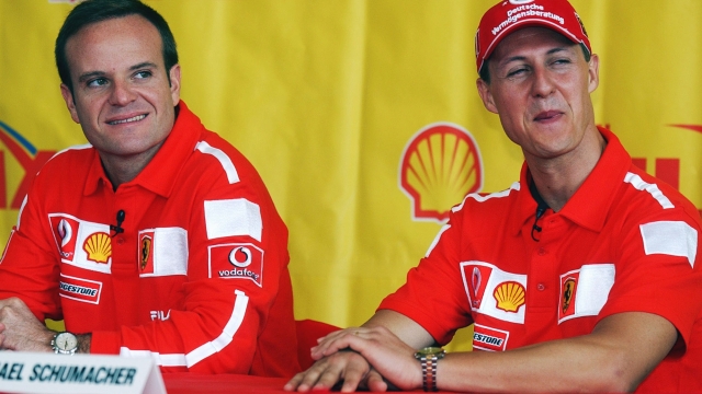 Ferrari drivers Michael Schumacher of Germany, right, and Brazil's Rubens Barrichello smile during a press conference in Melbourne, Australia, Thursday, March 6, 2003. The first Formula One grand prix of the year is to be held Sunday. (AP Photo/Ross Land)