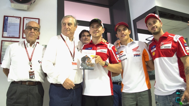 SCARPERIA, ITALY - JUNE 01:  (L-R) Carmelo Ezpeleta of Spain and Dorna CEO  and Dottor Claudio Marcello Costa of Italy and Jorge Lorenzo of Spain and Ducati Team and Marc Marquez of Spain and Repsol Honda Team and Andrea Dovizioso of Italy and Ducati Team pose during the presentation of the new book of Dottor Costa "L'eroe che e' in te" in media center during the MotoGp of Italy - Previews at Mugello Circuit on June 1, 2017 in Scarperia, Italy.  (Photo by Mirco Lazzari gp/Getty Images)