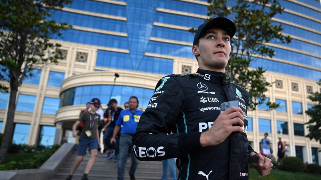 Third placed Mercedes' British driver George Russell walks after the Formula One Azerbaijan Grand Prix at the Baku City Circuit in Baku on June 12, 2022. (Photo by NATALIA KOLESNIKOVA / AFP)